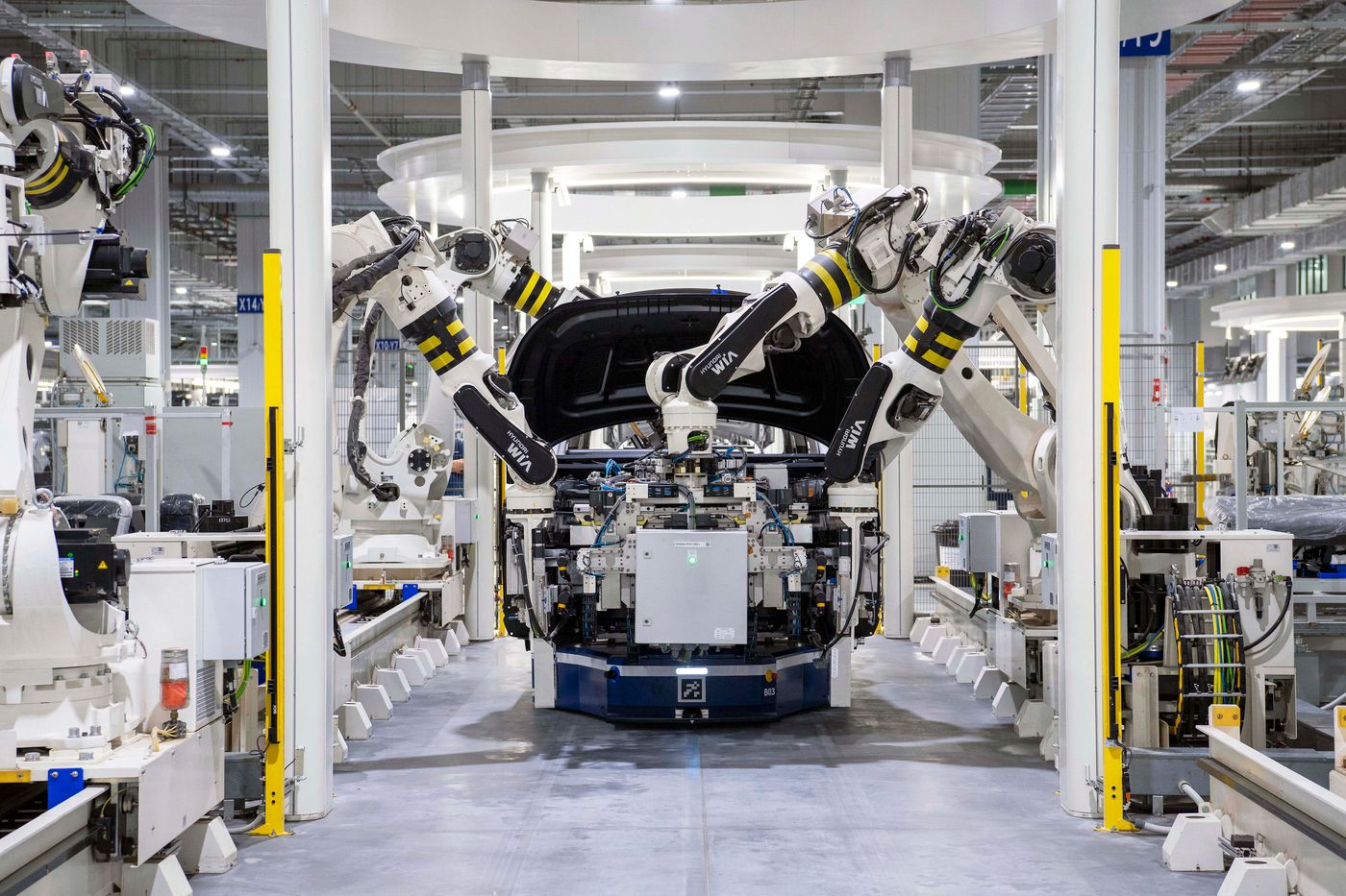 Robotic equipment in an automotive assembly facility, industry stock photography